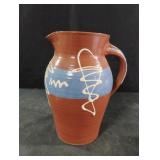 Hand-thrown studio pottery pitcher is crafted by