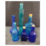 Blue and teal glass bottles