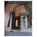 Grease gun, caulking gun and a trowel