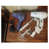 Hair dryers and a curling iron