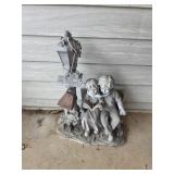 20" garden statue featuring a young boy and girl