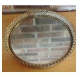 vintage Hollywood Regency-style round mirrored