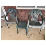 Green plastic chairs and small table