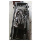 vintage wooden tool chest containing pipe