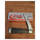 vintage Case XX pocket knife alongside its