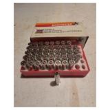 Partial vintage box and a red plastic loading