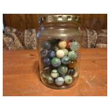 Glass jar of vintage marbles
