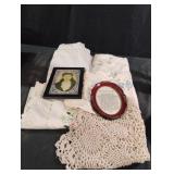 Vintage picture frames and table cloths and a