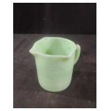 Vintage jadeite green measuring cup.