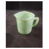 Vintage jadeite green measuring cup. Has a small