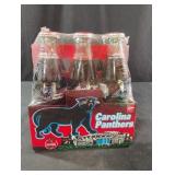 Coca-Cola collectible Carolina Panthers bottles.