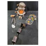 Wind chimes, resin frog, stacked turtles