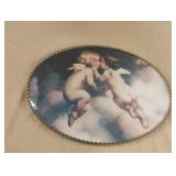 oval-framed print of "The Kiss", a famous vintage