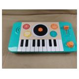 Hape DJ Mix & Spin Studio portable musical toy.
