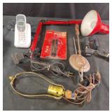 Adjustable lamp-works, trunk securing strap and