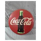 12" round metal Coca-Cola "button" sign featuring