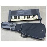Keyboard (needs repair) / Guitar Case