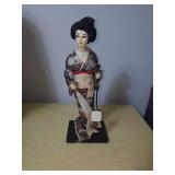 Japanese-Style Ceramic Figurine with Textile Accen