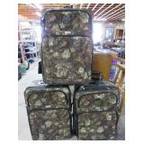 Three Identical Mid-Size Rolling Luggage Pieces