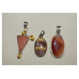 Three Polished Stone Pendants