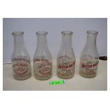 Four Vintage United Dairy Milk Bottles