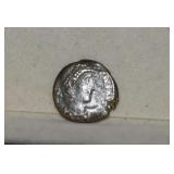 Unattributed Ancient Roman Copper Coin in Plastic