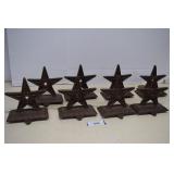 Eight Cast Iron Star Stocking Hangars