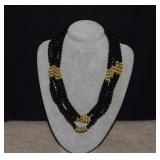 Six Strand Black & Gold Beaded Necklace