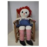 Raggedy Ann Doll Sitting On Chair
