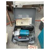 Makita jigsaw in case with blades