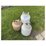 Three propane bottles. All refillable, newer type.
