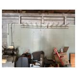 Metal pegboard with pegs.