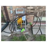 Garden hose and reel and wood rack. All one money.