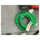 Three coils a brand new garden hose. Three coils .