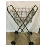 Old metal rolling cart with removable basket