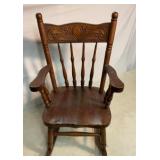 Antique hand carved childï¿½s rocking chair