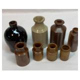 Group of old mini crock bottles