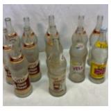 Collection of 24 ounce Vess glass bottles