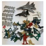 Plastic planes, barbed wire fence, soldiers