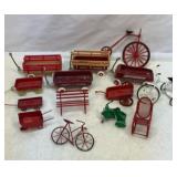 Collection of metal wagons, bicycles, etc.