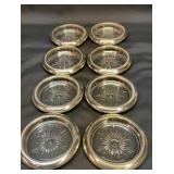 Eight glass coasters with silver plate edges