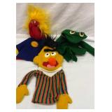 Three Sesame Street hand puppets