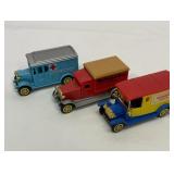 Three plastic toy trucks