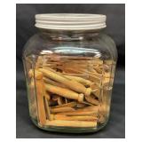 Old coffee jar full of old clothes pins