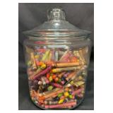 Large apothecary jar full of crayons