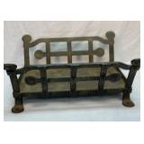 Heavy cast iron hearth log holder