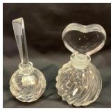 Two glass perfume bottles with glass stoppers
