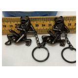 Two horny frog keychains