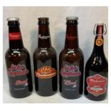 Three glass Budweiser banks and sealed bottle