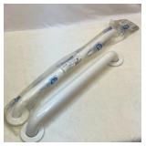 Two white grab bars. 24 inch and 18 inch center.